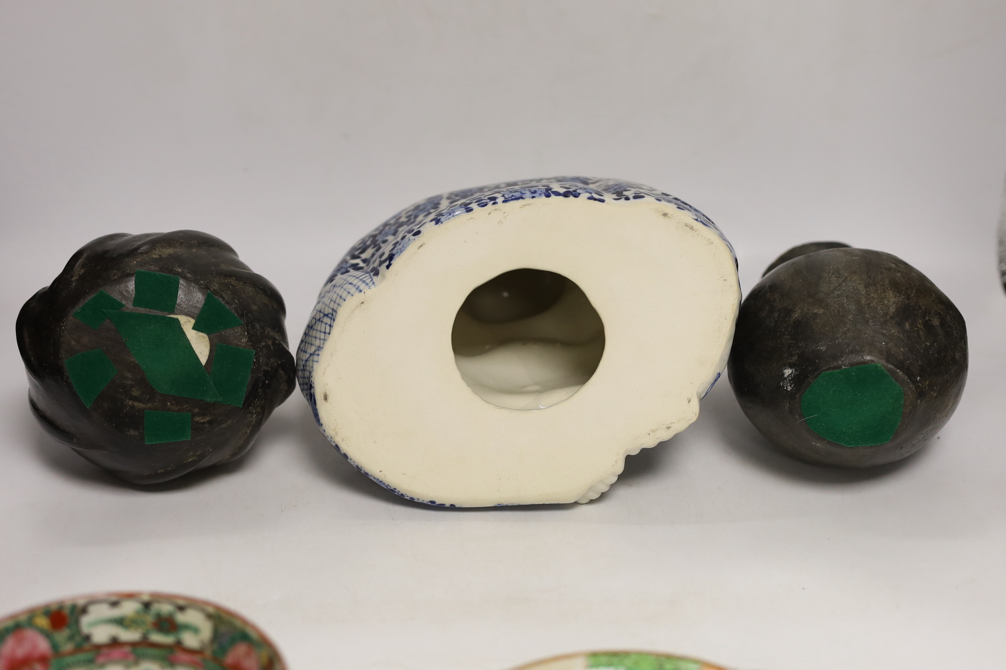 A Chinese blue and white buddha, 21cm, a famille rose dish and bowl and two vessels